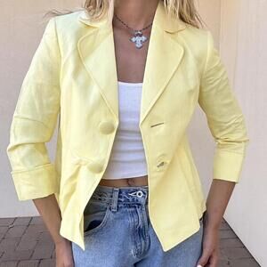 Yellow mini blazer with mid length sleeve and big funky buttons!